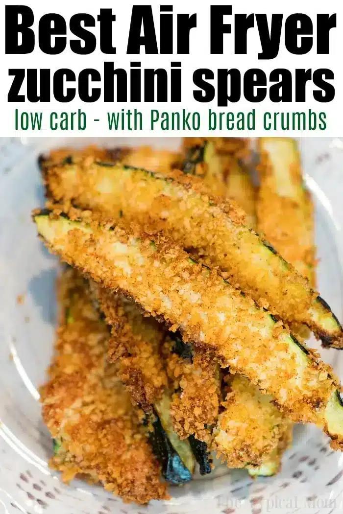 A bowl of golden-brown zucchini spears coated in Panko bread crumbs. The text above reads, "Best Air Fryer zucchini fries low carb - with Panko bread crumbs." The spears are arranged in a pile, showcasing their crispy texture.