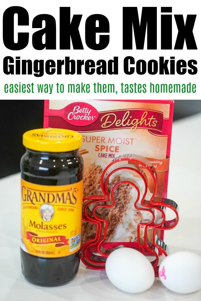 A jar of molasses, cake mix, and two eggs sit invitingly on the table alongside gingerbread-shaped cookie cutters, ready to craft delightful gingerbread cookies.