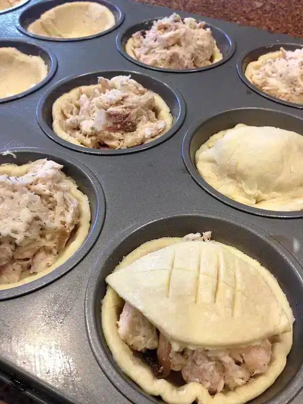 chicken pot pie with puff pastry in muffin tin