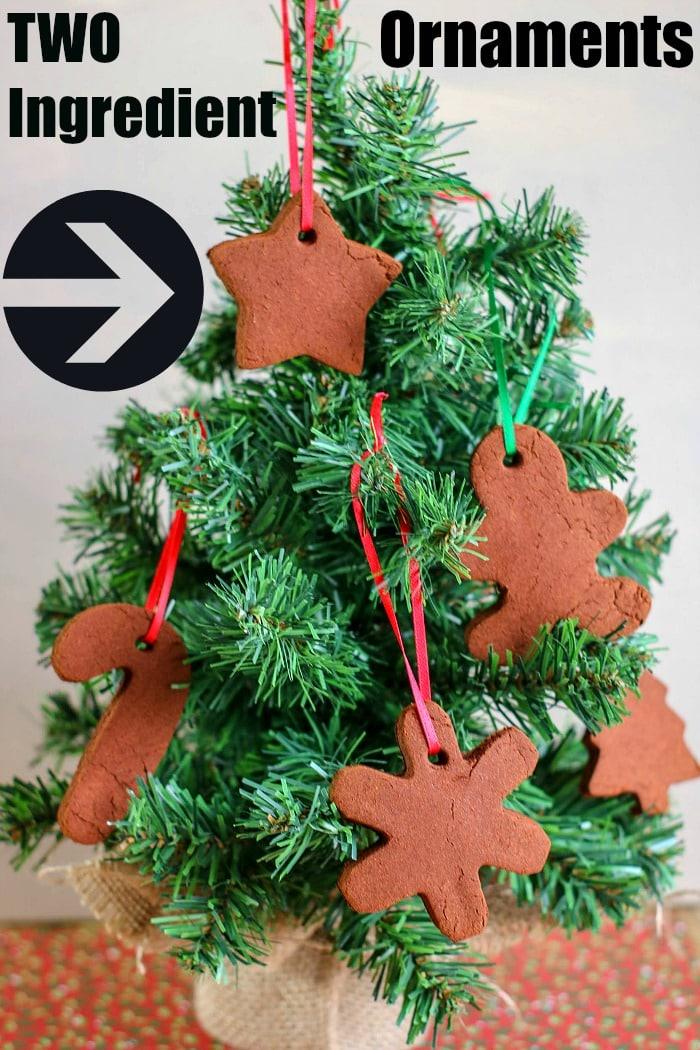 A mini Christmas tree adorned with DIY two-ingredient cinnamon ornaments in various shapes, perfect for those following a cinnamon ornament recipe.