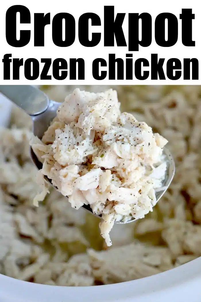 A spoonful of shredded crockpot frozen chicken over a crockpot with the text Crockpot Frozen Chicken above.