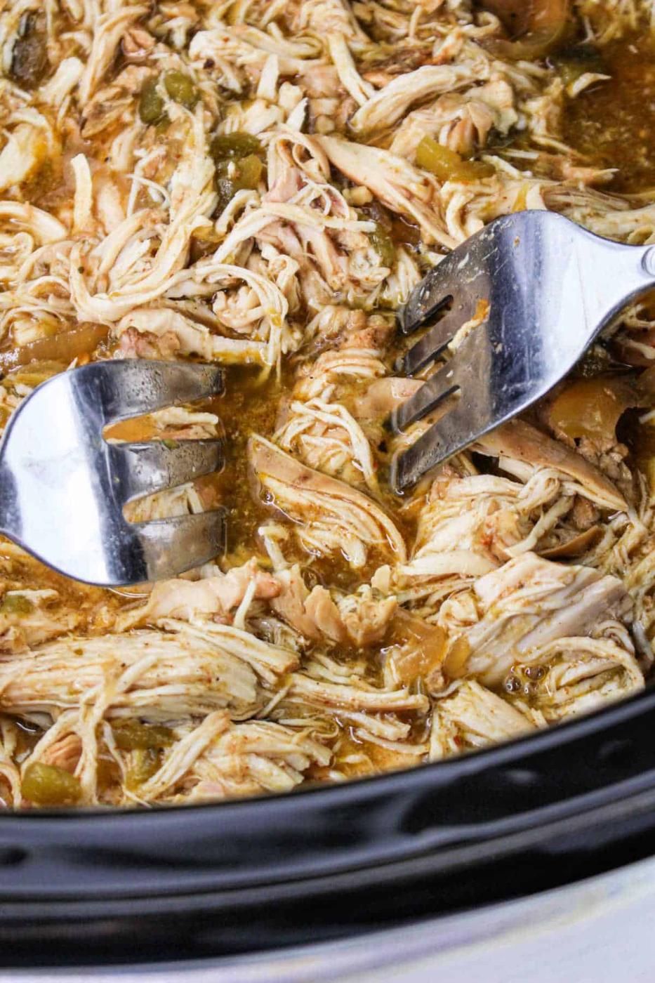 shredding chicken breasts with two forks