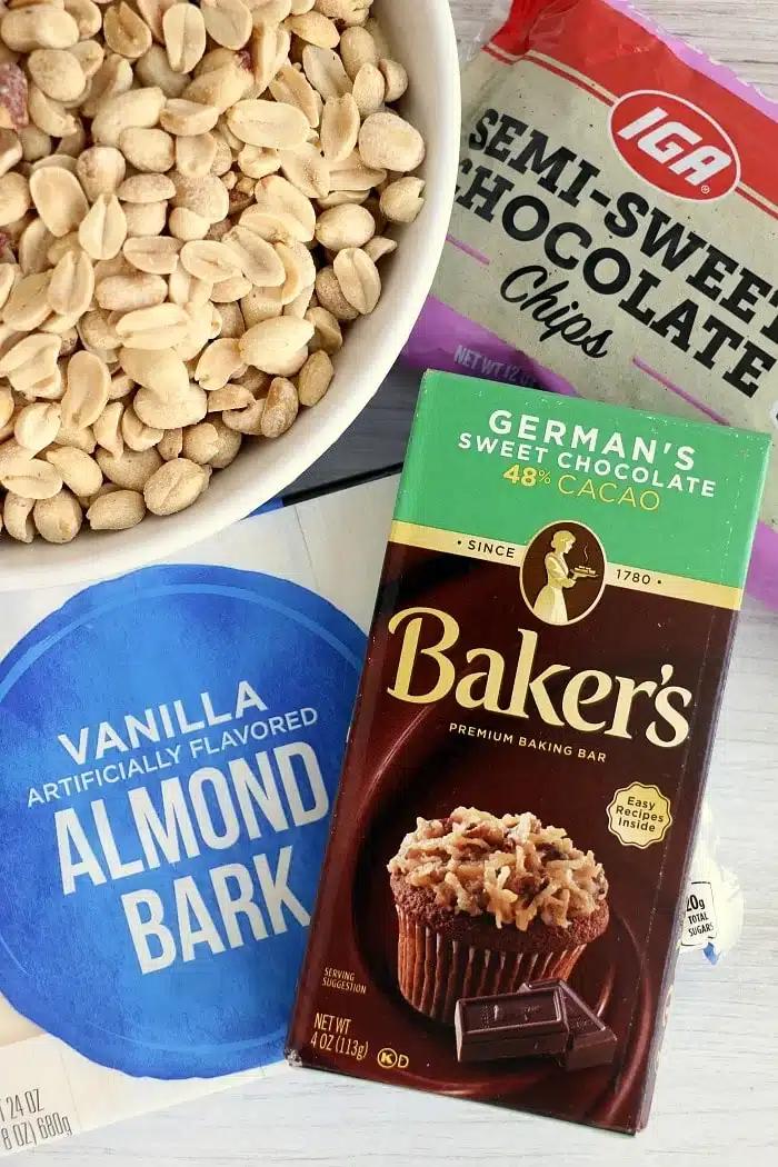 Bowl of peanuts, a bag of chocolate chips, almond bark, and a Baker’s German’s sweet chocolate bar—perfect ingredients for making irresistible crockpot peanut clusters.