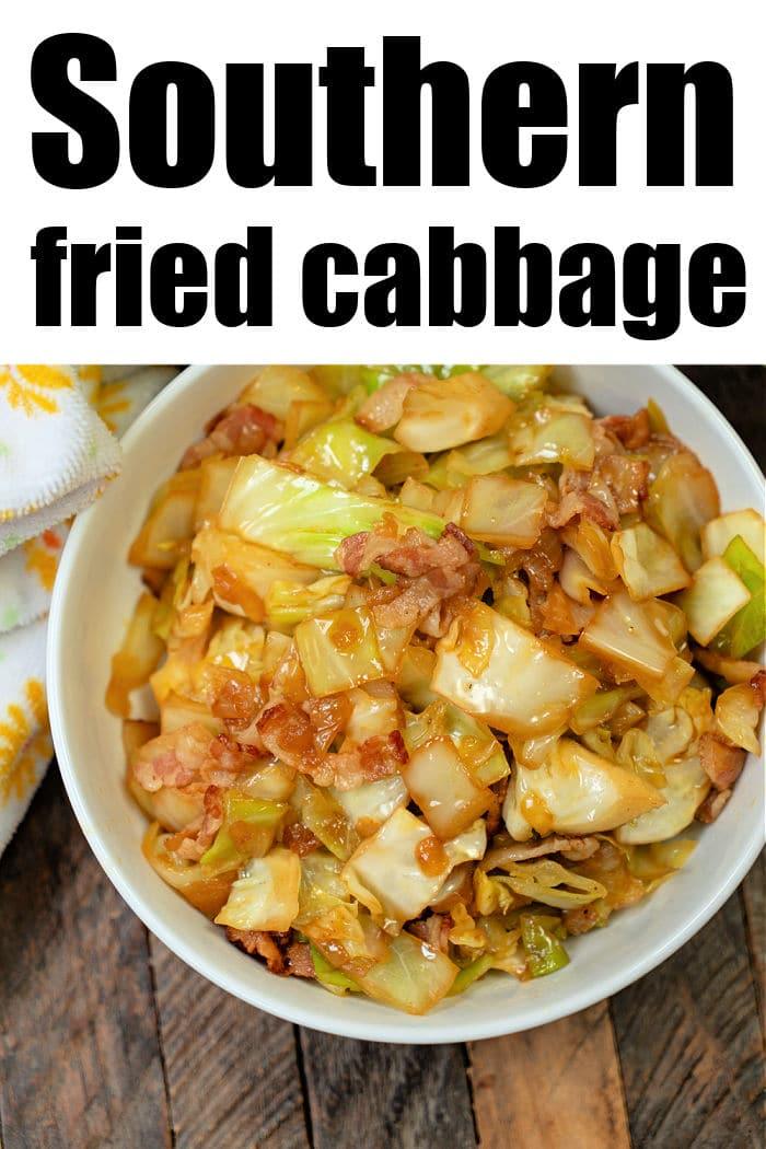 A bowl of Southern Fried Cabbage, brimming with crispy bacon pieces, sits invitingly on a wooden table.