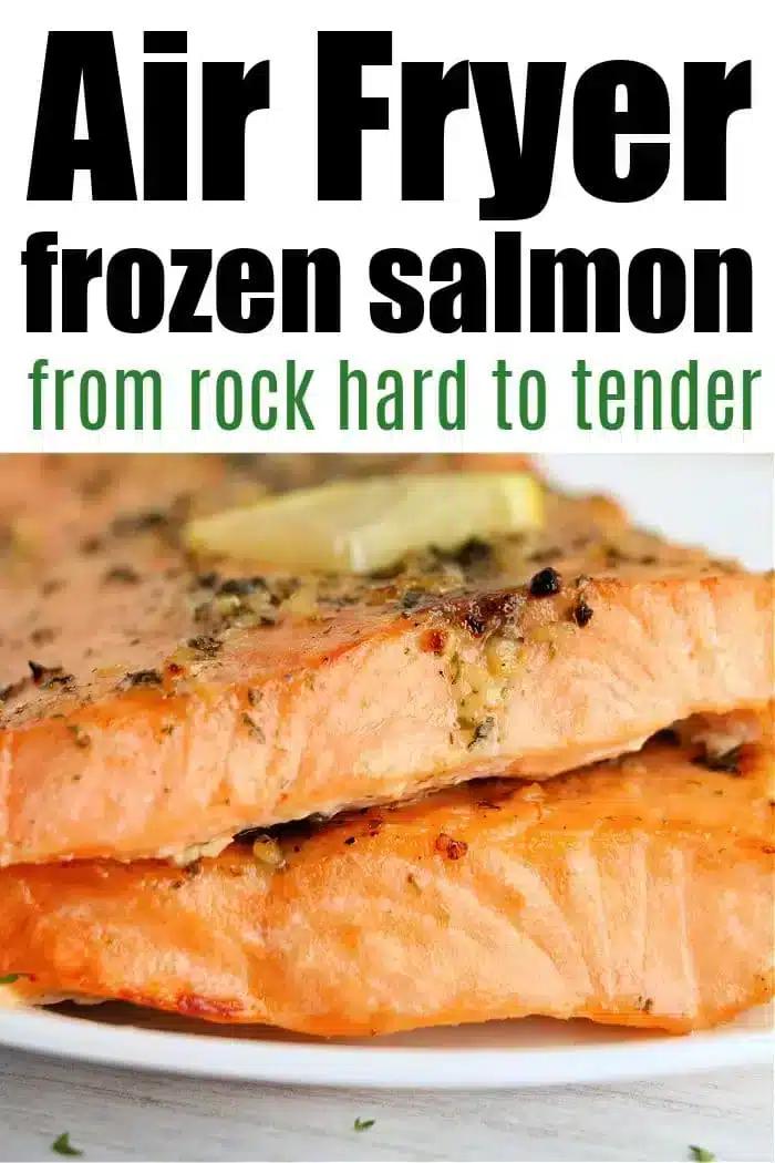Close-up of two cooked salmon fillets, seasoned with herbs and topped with a slice of butter on a white plate. Text at the top reads, "Frozen salmon in air fryer: from rock hard to tender.