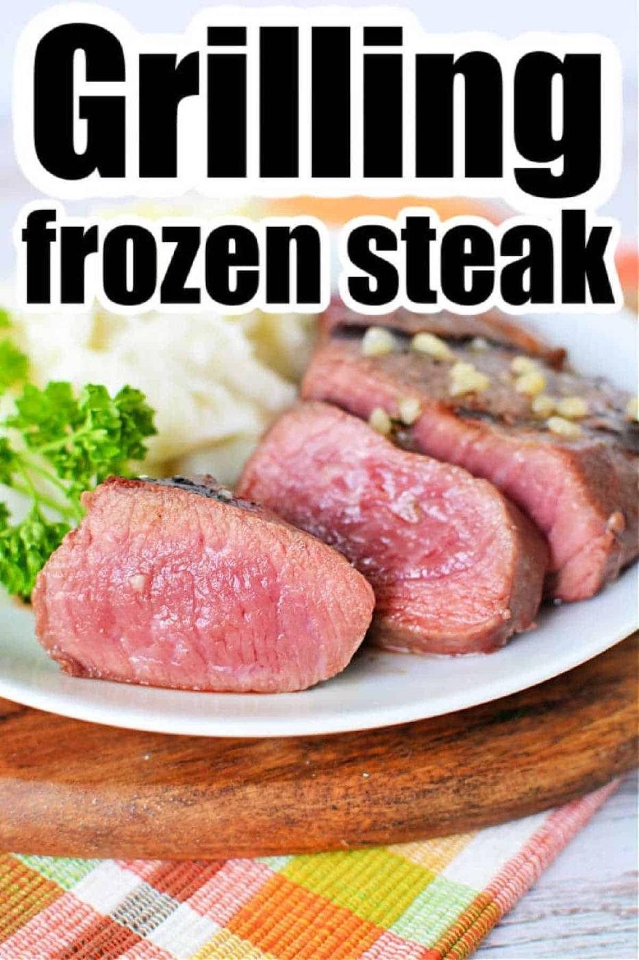 A plate with thick, juicy slices of rare steak, parsley, and mashed potatoes; text reads How to Grill Frozen Steak.