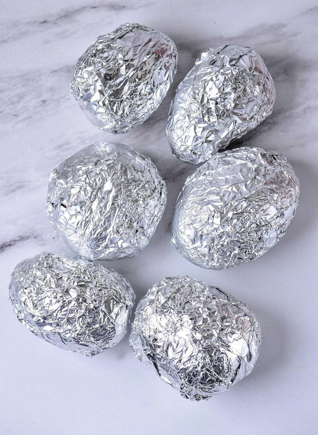 Baked Potato in Oven Wrapped in Foil