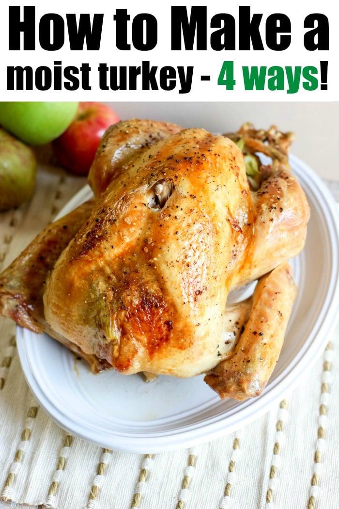 A roasted turkey with golden-brown skin sits on a white plate, surrounded by juicy apples. The text reads, "How to Make a Moist Turkey - 4 Ways!" Pair it with a delightful cast iron apple crisp for the perfect feast.