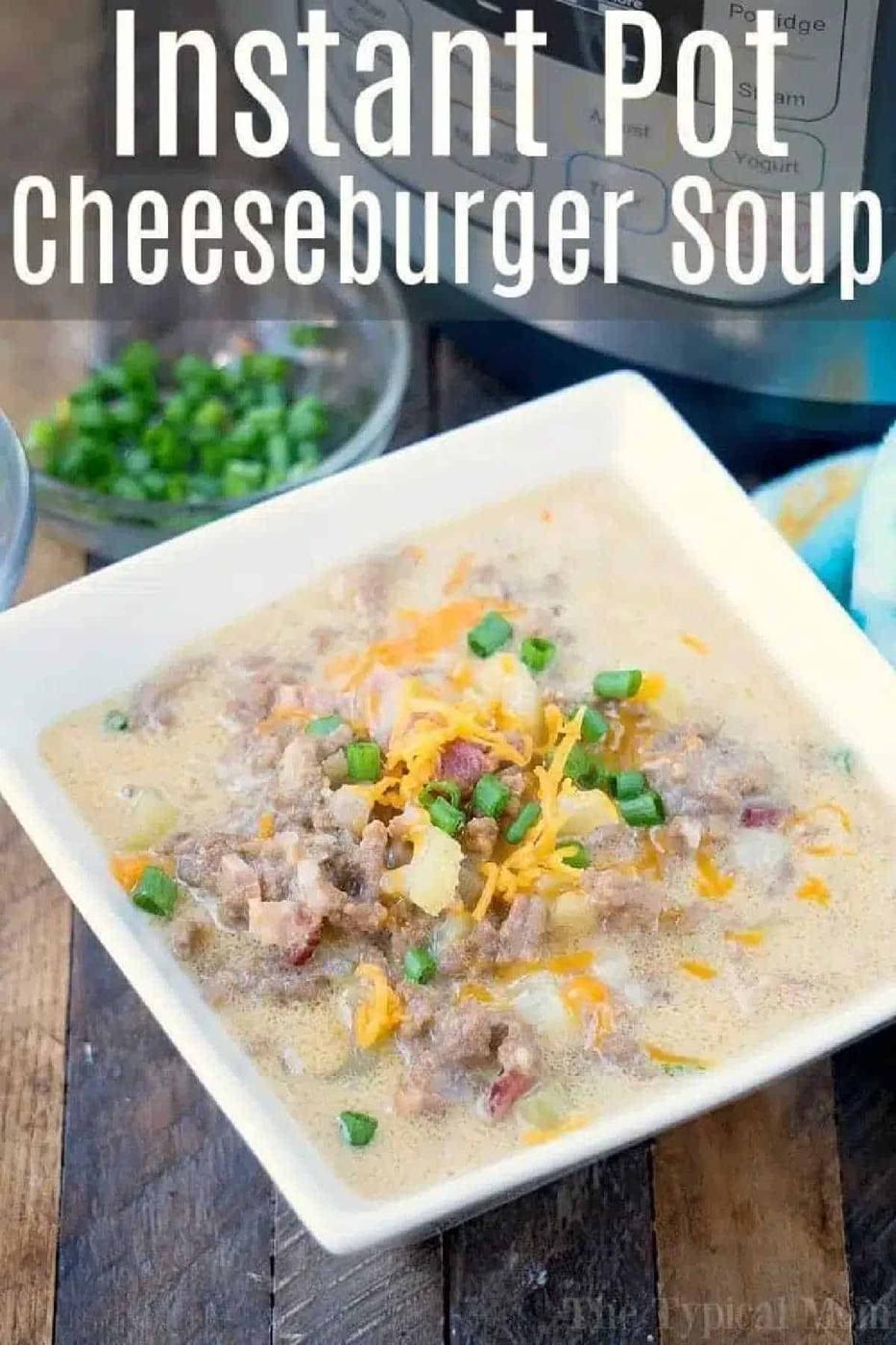 Square bowl of instant pot cheeseburger soup topped with shredded cheese and green onions, with an Instant Pot in the background.