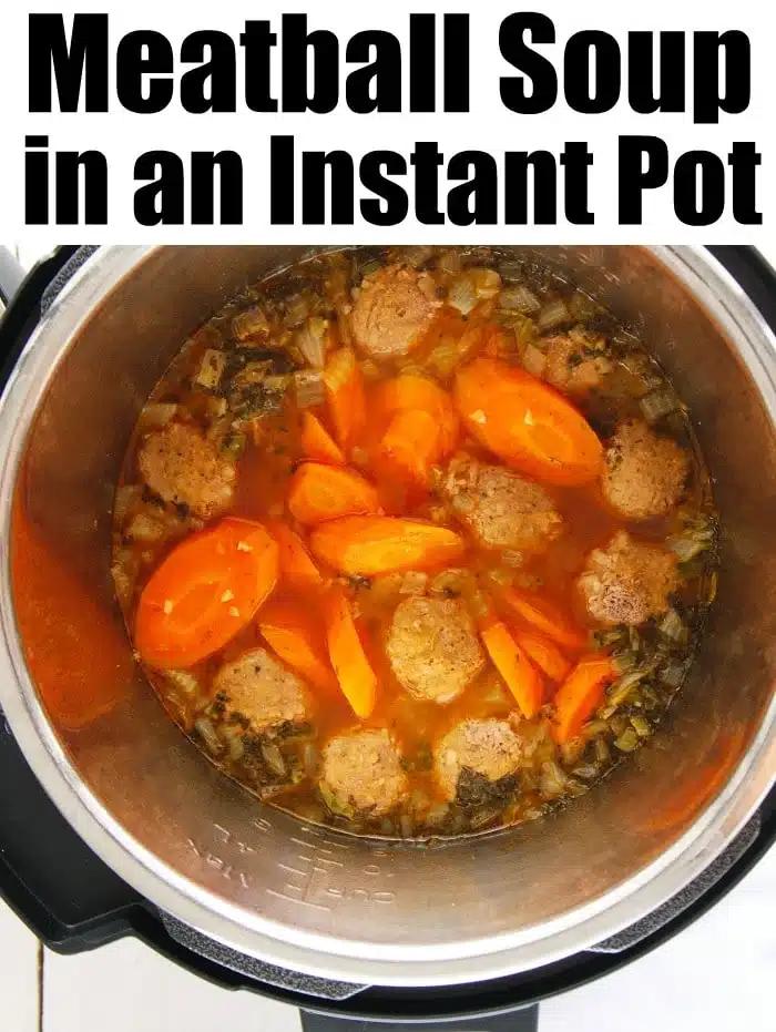 Instant Pot meatball soup with carrots and herbs simmering to perfection, viewed from above.
