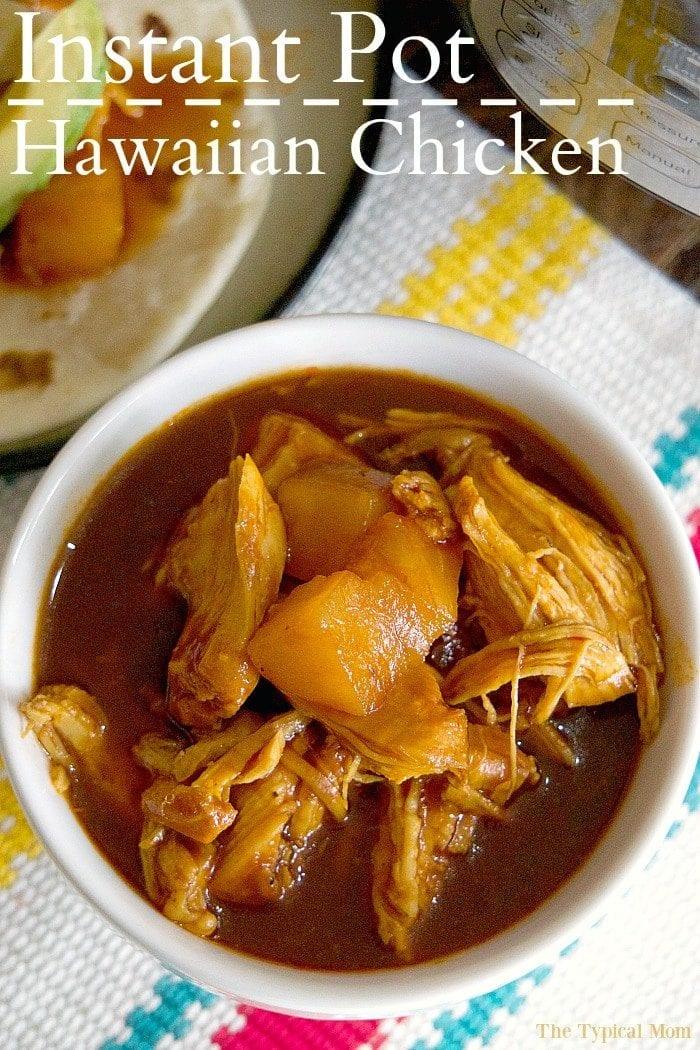 Bowl of Instant Pot shredded Hawaiian chicken with pineapple chunks and sauce, labeled Instant Pot Hawaiian Chicken.