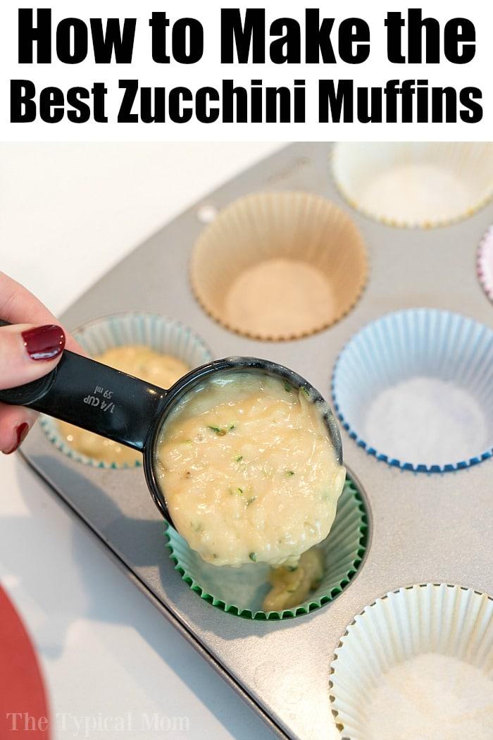 Scooping zucchini muffin batter into a lined muffin tin.