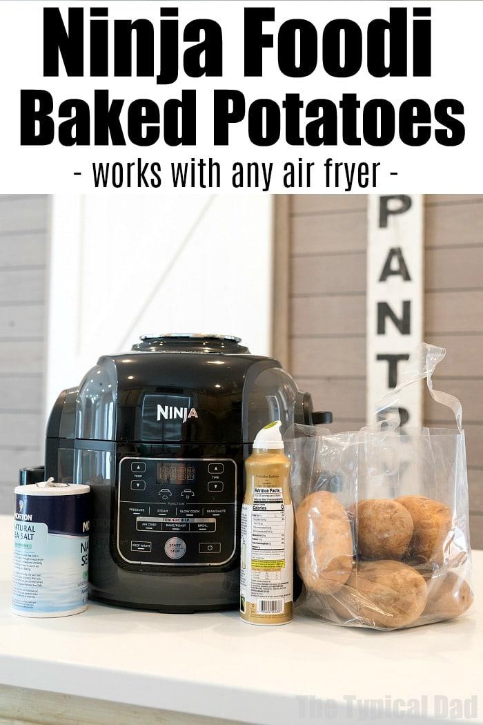 Ninja Foodi baked potatoes in a bag sit on the counter with salt and oil beside a Ninja air fryer. "Ninja Foodi Baked Potatoes" is written above, highlighting this simple and delicious method.