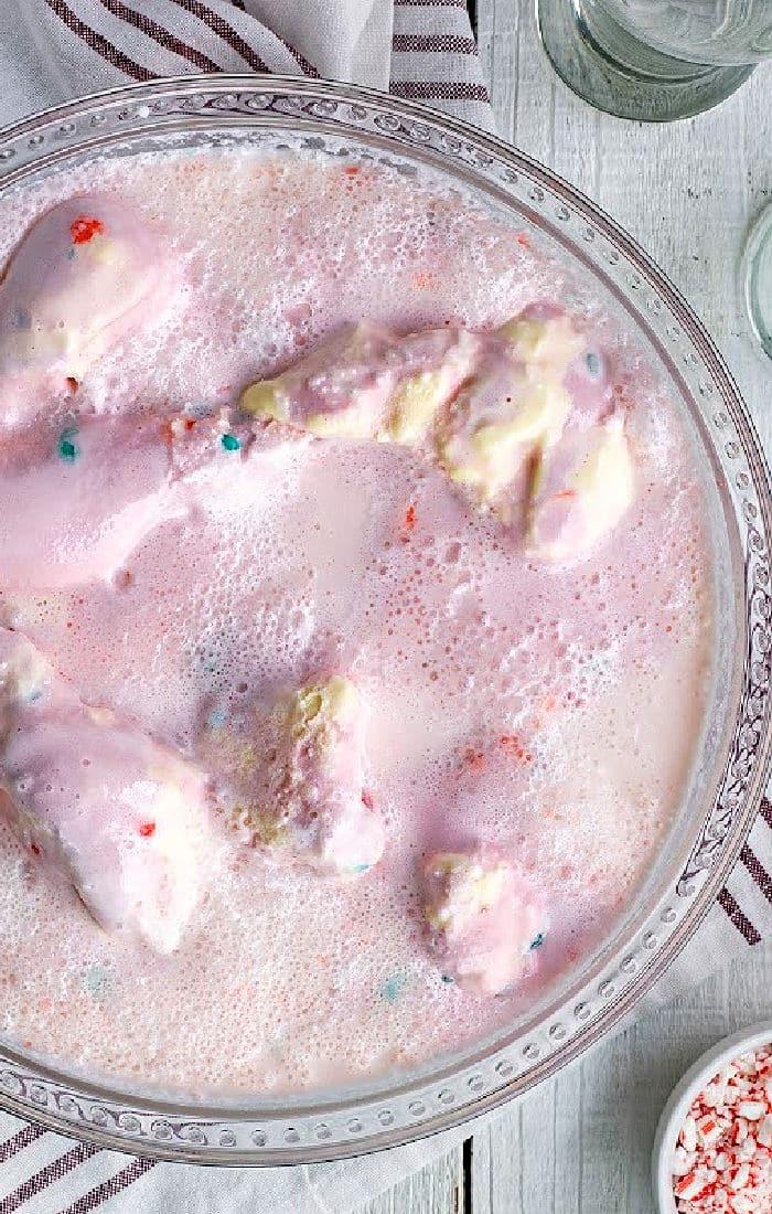 A glass bowl filled with pink, frothy punch and melting scoops of colorful ice cream—the perfect centerpiece for any gathering. Try this delightful Pink Punch Recipe to add a sweet splash of fun to your next party.