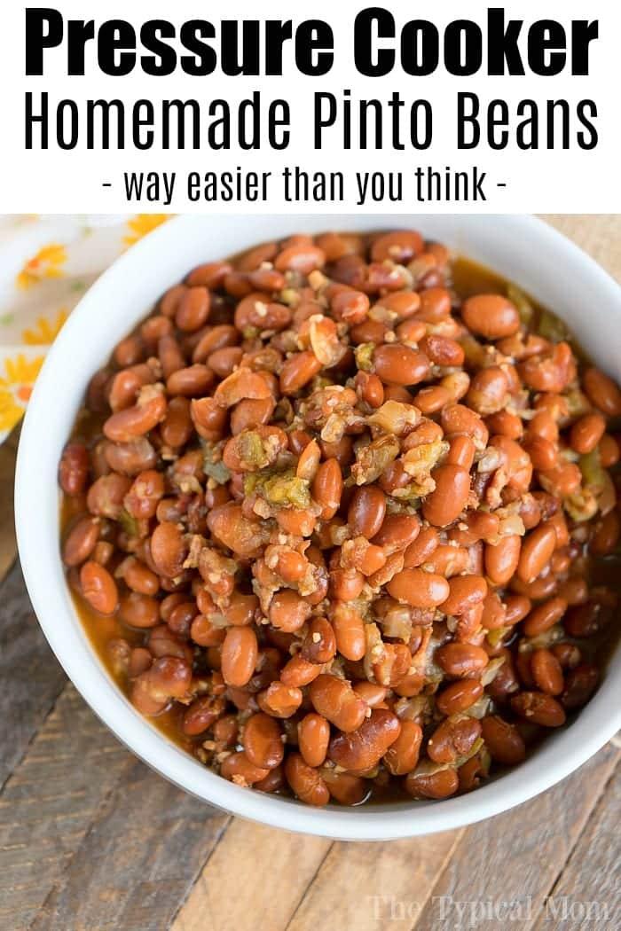 A bowl of pressure cooker pinto beans, brown with a glossy finish, mixed with chopped peppers and onions. Text above the image reads: "Pressure Cooker Pinto Beans - way easier than you think.