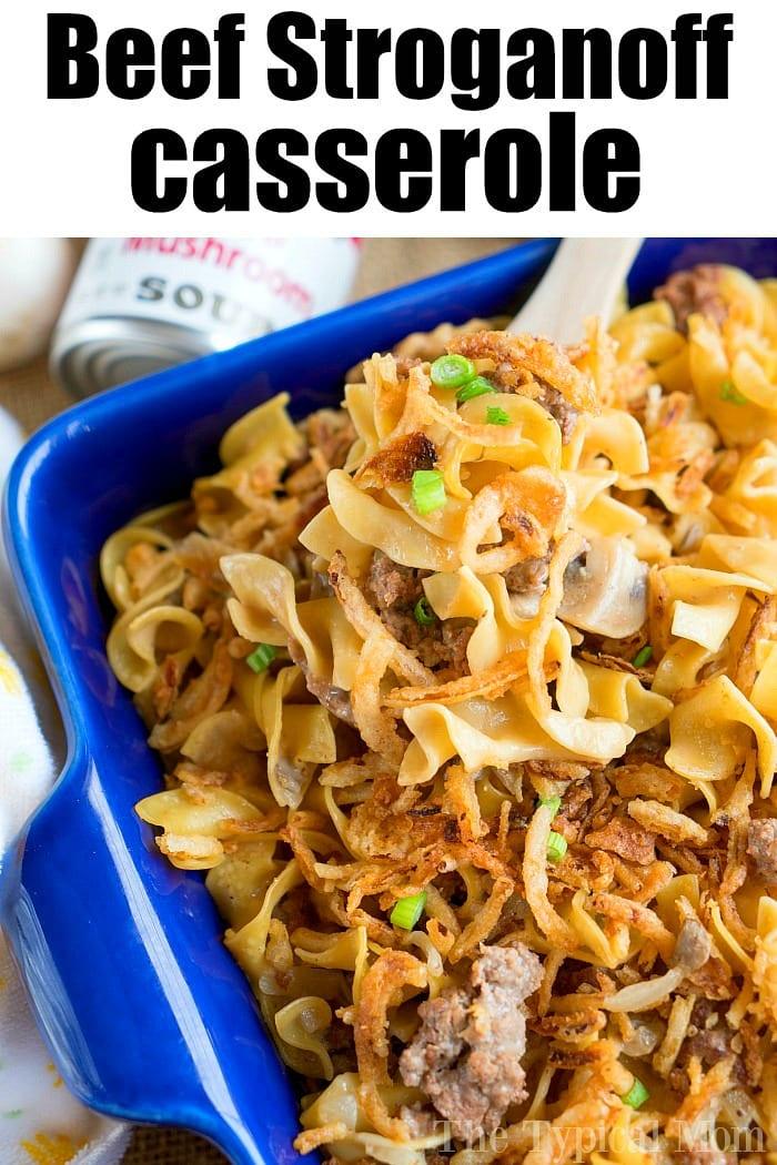 A blue dish filled with pressure cooker stroganoff casserole, topped with green onions and crispy onions.