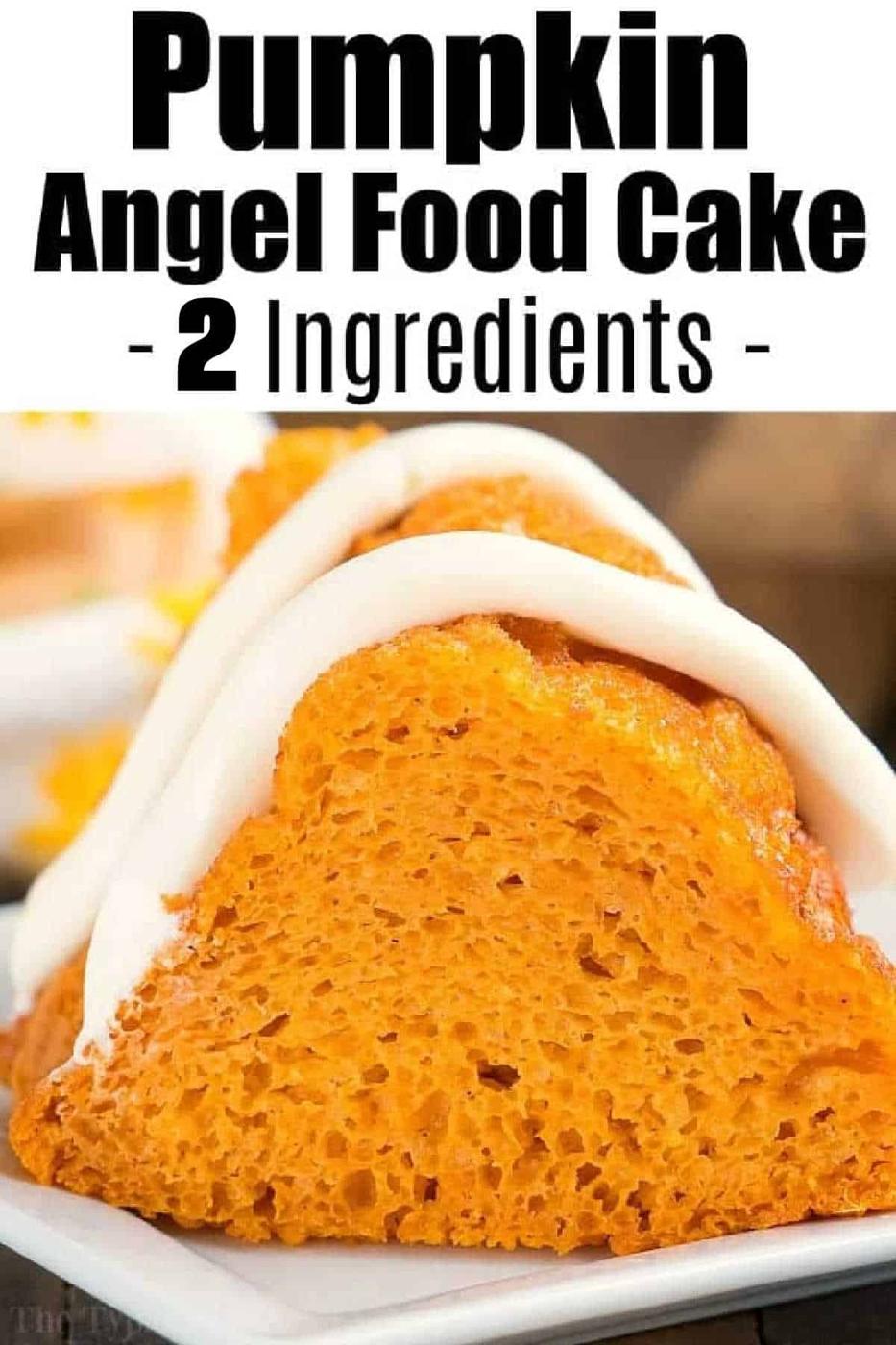 A slice of pumpkin angel food cake topped with white icing sits elegantly on a white plate.