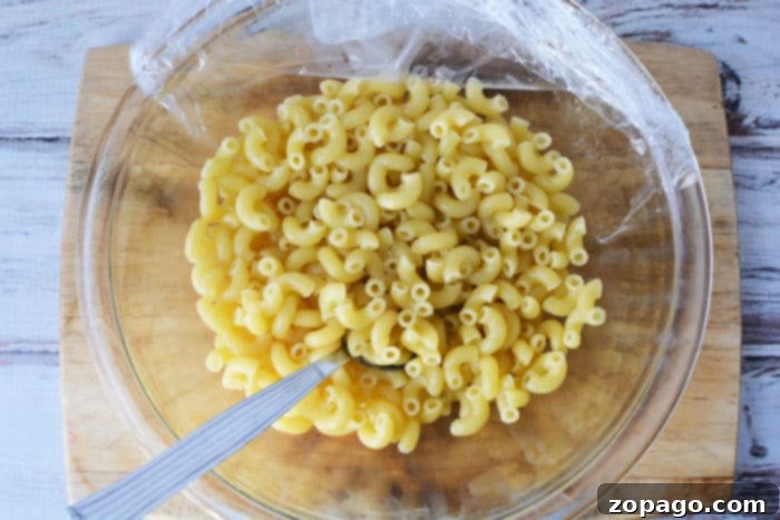 Effortless Microwave Pasta 6 How to Cook noodles in the Microwave, showing cooked pasta ready for seasoning.