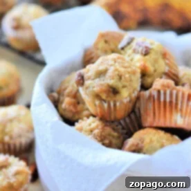 Bake Perfect Mini Muffins Your 350 Degree Timeline 7 A bowl of mini banana nut muffins lined with a white napkin, with more delicious mini banana muffins and ripe bananas in the background.