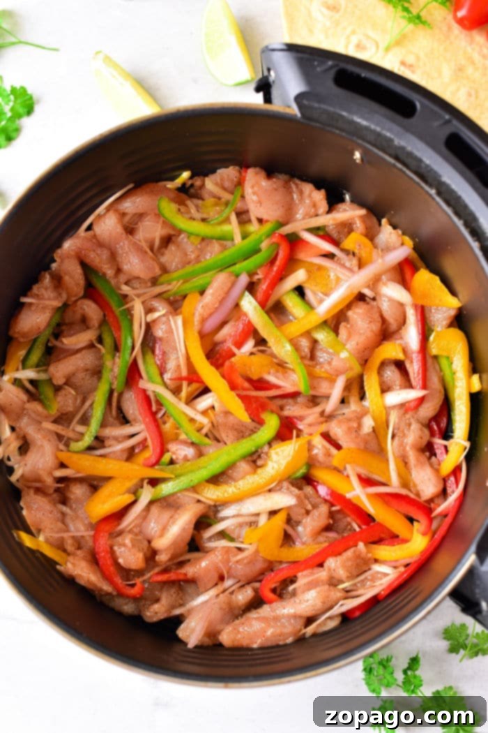 Sizzling Fajita Chicken Tacos 4 Perfectly cooked chicken fajitas, rich with seasoned chicken strips and colorful bell peppers, ideal for air frying and serving.