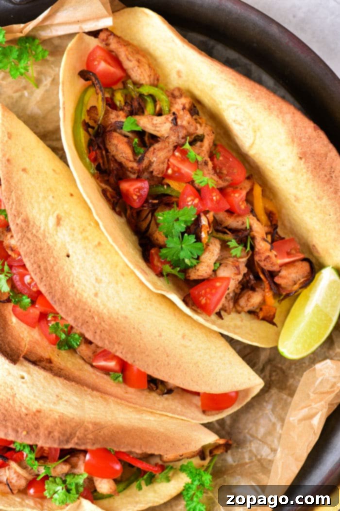 Sizzling Fajita Chicken Tacos 8 Delicious chicken fajita tacos with vibrant fillings and fresh toppings, ready to be enjoyed.