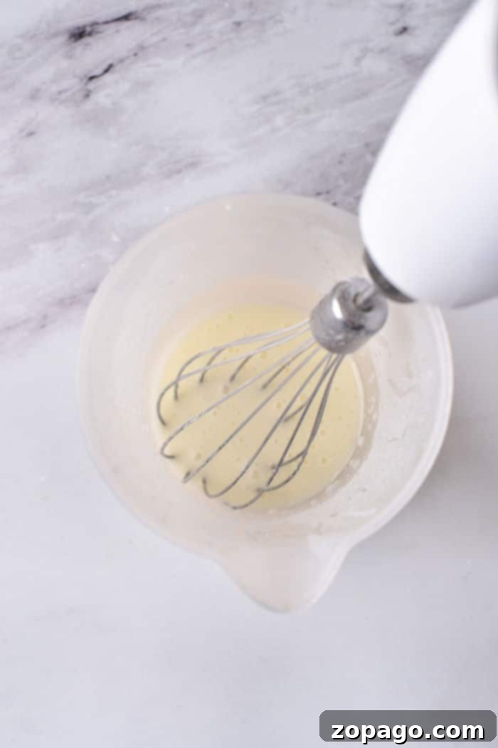 Cinnamon Streusel Coffee Cookies 6 Powdered sugar glaze being drizzled on cookies