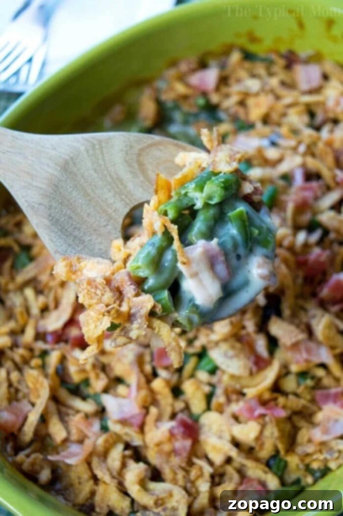 Smoky Bacon Green Bean Bake 3 Easy Green Bean Casserole with Bacon, garnished with fresh herbs
