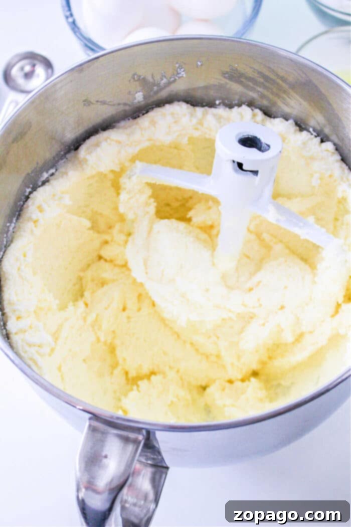 Perfect Homemade Sara Lee Pound Cake 4 The step-by-step process of preparing a 7Up Pound Cake, showing the smooth, creamy batter in a mixing bowl, ready to be poured into the bundt pan.