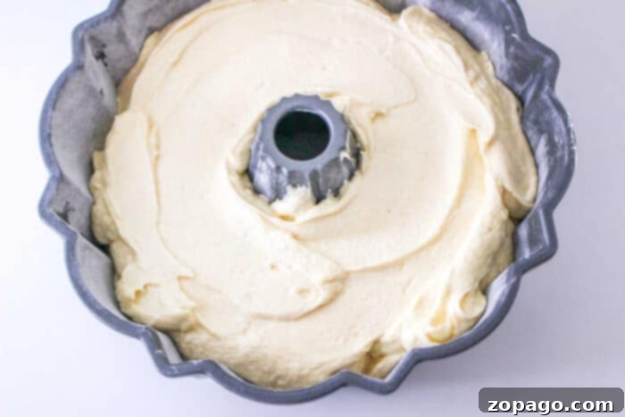 Perfect Homemade Sara Lee Pound Cake 5 A delicious slice of Copycat Sara Lee Pound Cake, beautifully glazed and perfectly baked, resting on a serving plate.
