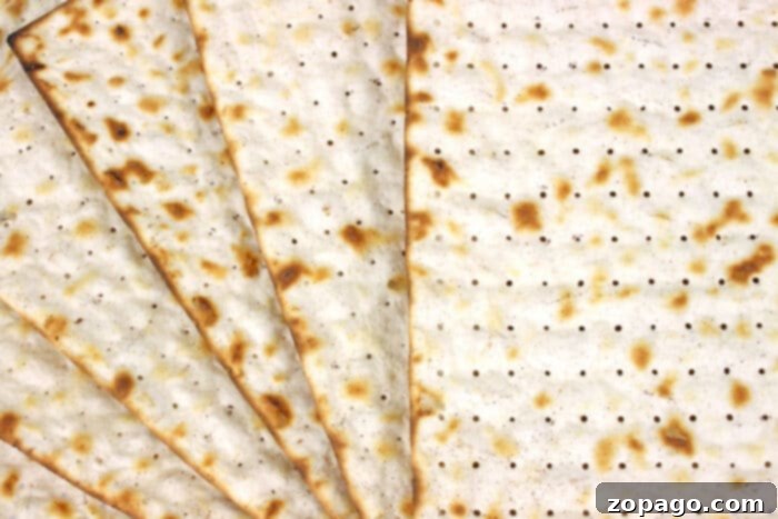 Matzo Ball Explained: Definition and Easy Recipe 3 A close-up of matzah crackers, the fundamental ingredient for matzo meal