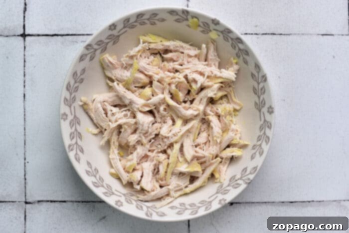Soul-Warming Chicken Matzo Ball Soup 4 Close-up of tender, shredded rotisserie chicken, ideal for adding to soups and stews for extra flavor and protein.