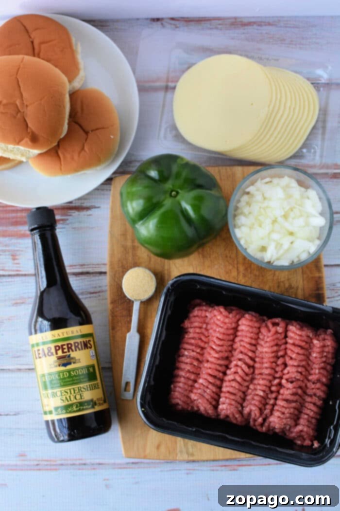 Philly Joe Beef Melt 3 Ingredients for Philly Cheesesteak Sloppy Joes, including ground beef, peppers, onions, and cheese.