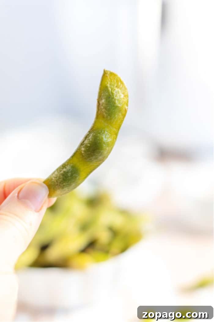 Perfectly Cooked Frozen Edamame 2 A vibrant bowl of cooked edamame pods, ready to be enjoyed.