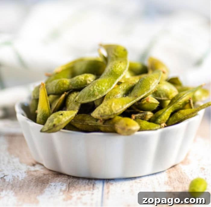 Perfectly Cooked Frozen Edamame 4 A perfectly cooked bowl of seasoned frozen edamame, garnished for a delightful presentation.