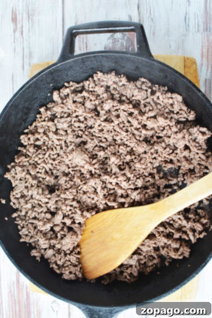 Cooking Ground Beef to Perfection 4 Ground beef sizzling in a pan, demonstrating proper cooking technique.