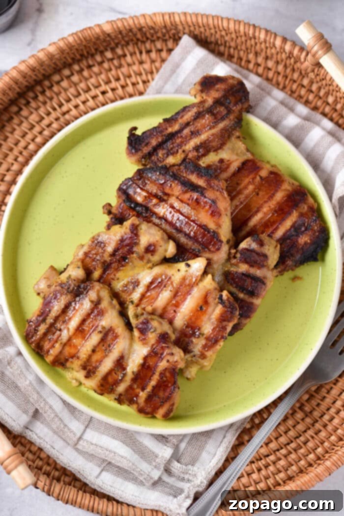 Perfect Grilled Chicken Thighs 2 Deliciously Grilled Bone-In Chicken Thighs on a BBQ