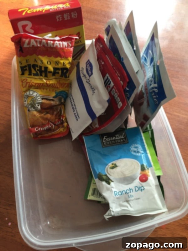 Reimagining Plastic Containers 4 Organizing kitchen packets with a shallow repurposed plastic container