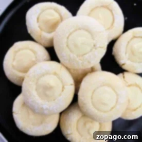 Effortless Lemon Drop Cookies 5 A delightful plate of lemon cookies from cake mix, each with a luscious white chocolate center.