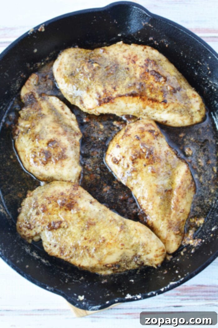Pan-Seared Cast Iron Chicken Breast 4 Garlic Butter Chicken Breast - glistening with sauce