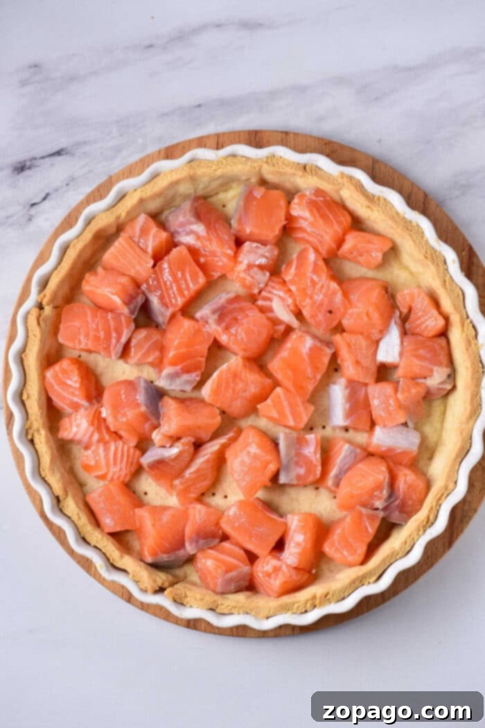 Gourmet Salmon Quiche 4 Golden-brown smoked salmon quiche, showcasing its rich, savory filling.
