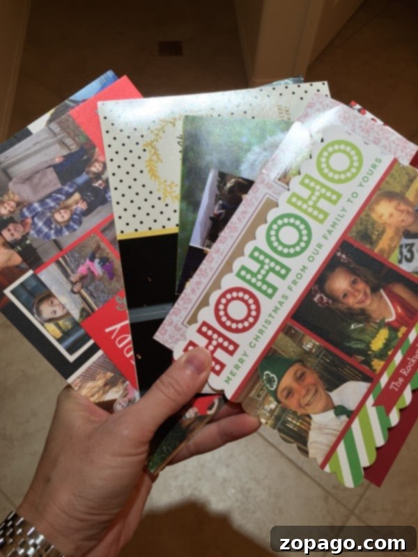 What to do with Christmas cards once the season is over. A free tip on what to do with holiday cards after taking them down and how to do it. Ring-bound Christmas card album, showing cards threaded onto a metal ring.