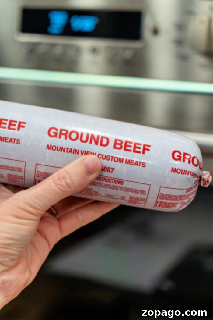 Easy Oven Ground Beef 2 Ground Beef in Oven on a sheet pan, ready to be seasoned and cooked.
