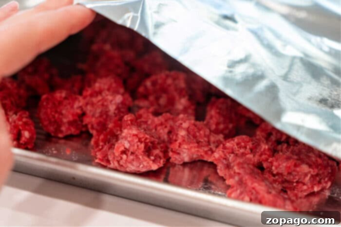 Easy Oven Ground Beef 4 Cooking Hamburger in Oven, broken into pieces.