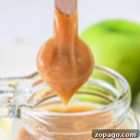 Caramel being dripped from a stick into a glass jar, with dulce de leche notes enhancing its richness, and a green apple in the background. The sweetness captures the warmth of a pressure-cooked treat.