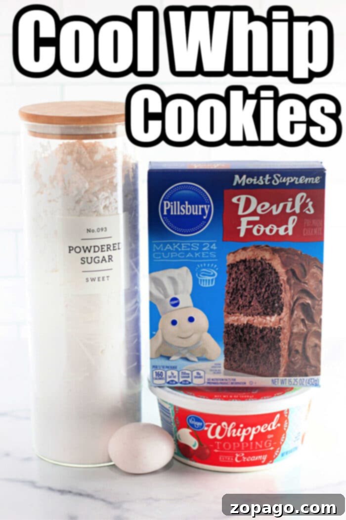 Dreamy Cool Whip Cake Cookies 3 A batch of freshly baked crinkle cookies made with Cool Whip and chocolate cake mix, showcasing their delightful texture.