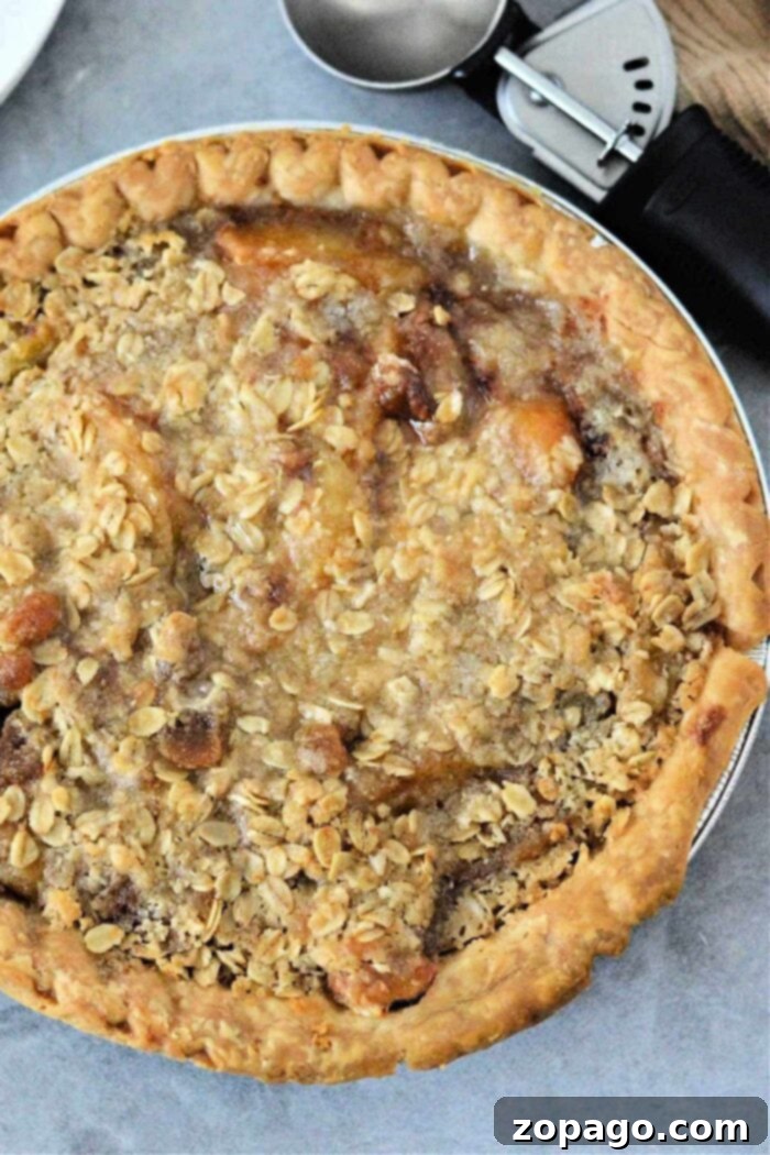 Pantry Peach Pie 2 A freshly baked canned peach pie with a golden oat crumble topping.