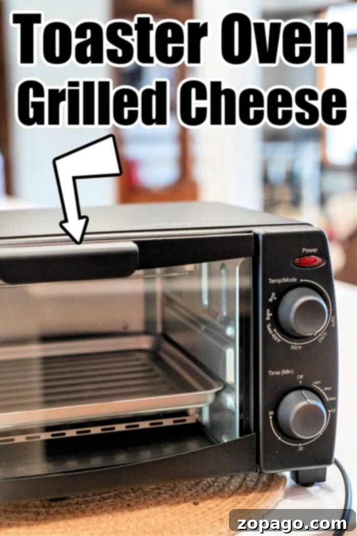 Perfect Toaster Oven Cheese Melts 4 Perfectly grilled cheese sandwiches being removed from a toaster oven.