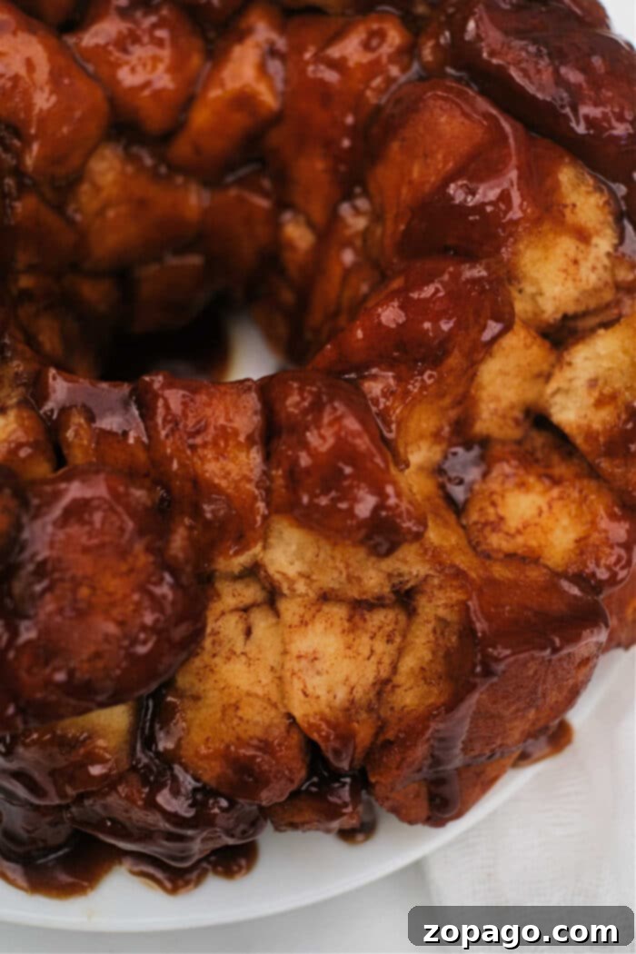 Next-Level Pillsbury Cinnamon Rolls 7 Warm monkey bread made from Grands cinnamon rolls, being pulled apart.