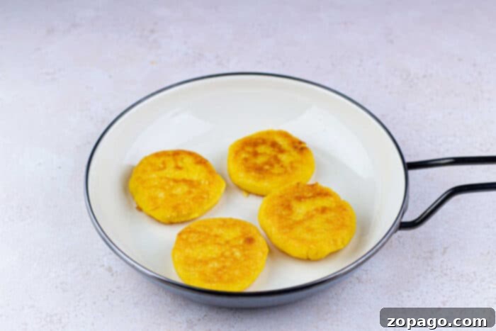 Crispy Cornbread Cakes 5 Uncooked cornbread patties shaped and ready for frying
