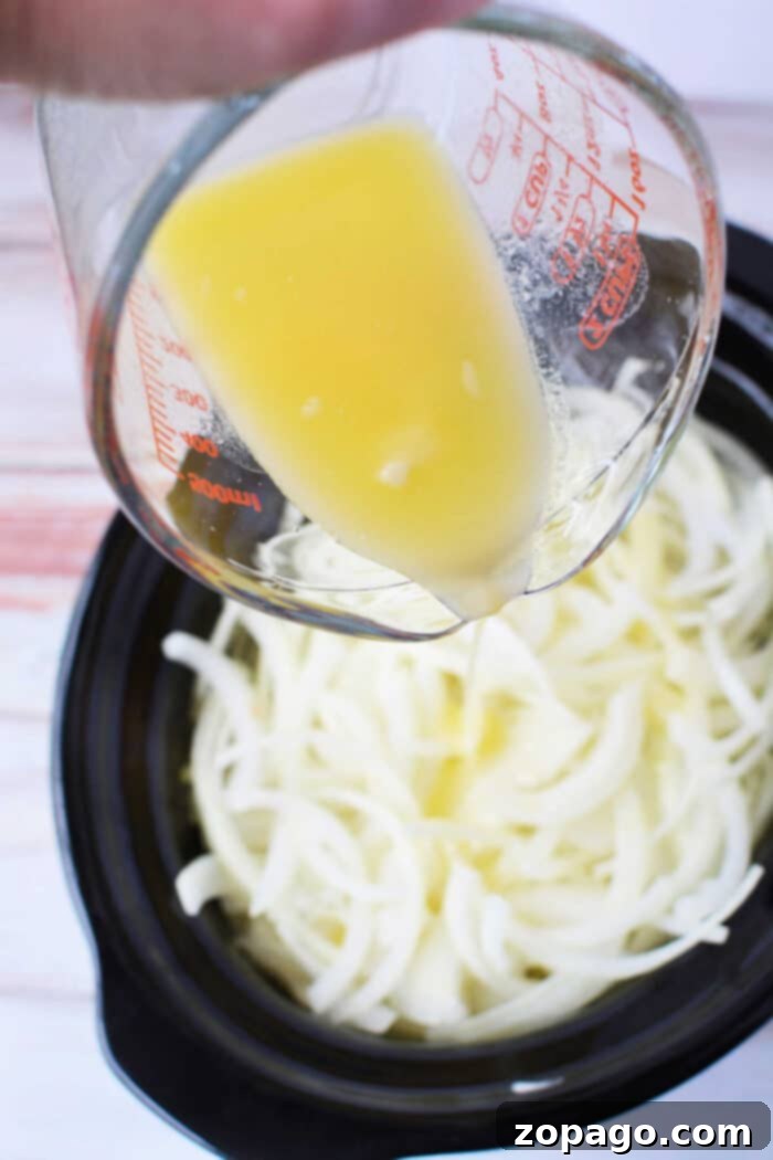 Slow Cooker Onion Gold 4 Slow Cooker Onions Caramelized - close-up of fully caramelized onions in a slow cooker, rich and golden brown.